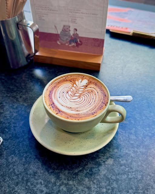Latte with rosetta latte art, second cup